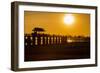 Sunset over the lake near wooden footbridge, Myanmar.-Michele Niles-Framed Photographic Print