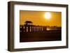 Sunset over the lake near wooden footbridge, Myanmar.-Michele Niles-Framed Photographic Print