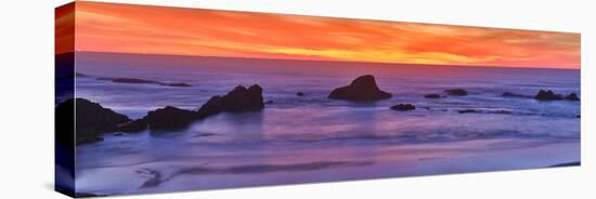 Sunset over the Pacific Ocean from Seal Rock along the Oregon Coast.-Darrell Gulin-Stretched Canvas