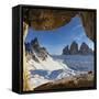 Sunset over the snow capped Tre Cime di Lavaredo and Monte Paterno seen from rock cave-Roberto Moiola-Framed Stretched Canvas