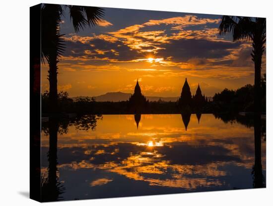 Sunset reflected in the infinity pool at Aureum Palace Hotel, Bagan, Mandalay Region, Myanmar-null-Stretched Canvas