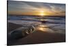 Sunset reflecting off the water on the sand of a beach-Sheila Haddad-Stretched Canvas