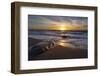 Sunset reflecting off the water on the sand of a beach-Sheila Haddad-Framed Photographic Print