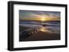 Sunset reflecting off the water on the sand of a beach-Sheila Haddad-Framed Photographic Print