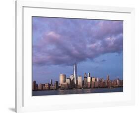 Sunset reflects off the buildings of lower Manhattan, seen from the water, New York City, New York.-Brenda Tharp-Framed Photographic Print