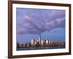 Sunset reflects off the buildings of lower Manhattan, seen from the water, New York City, New York.-Brenda Tharp-Framed Photographic Print