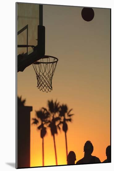 Sunset scenes, Venice Beach, Southern California, USA. Outdoor basketball court-Stuart Westmorland-Mounted Photographic Print