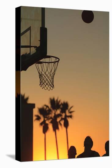 Sunset scenes, Venice Beach, Southern California, USA. Outdoor basketball court-Stuart Westmorland-Stretched Canvas