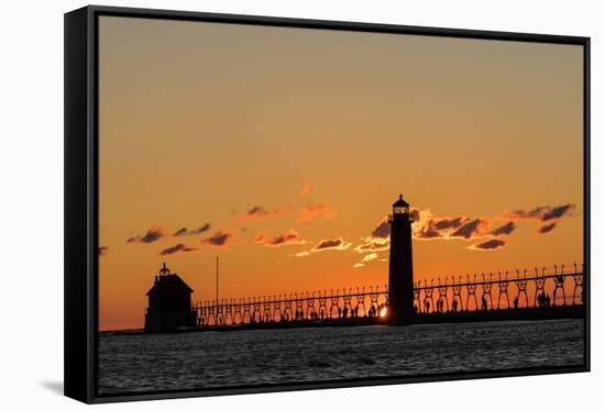 Sunset Silhouettes the Grand Haven Lighthouse in Grand Haven, Michigan, Usa-Chuck Haney-Framed Stretched Canvas