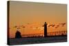 Sunset Silhouettes the Grand Haven Lighthouse in Grand Haven, Michigan, Usa-Chuck Haney-Stretched Canvas