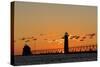 Sunset Silhouettes the Grand Haven Lighthouse in Grand Haven, Michigan, Usa-Chuck Haney-Stretched Canvas