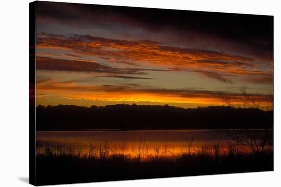 Sunset sky over waters of Eagle Creek Reservoir, Ragle Creek Park, Indianapolis, Indiana, USA-Anna Miller-Stretched Canvas