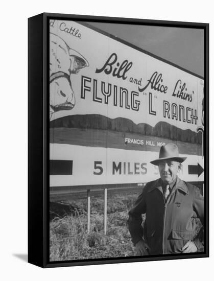 Super Rich Texas Millionaires William Likins Standing in Front of Sign at Main Entrance to Ranch-Michael Rougier-Framed Stretched Canvas