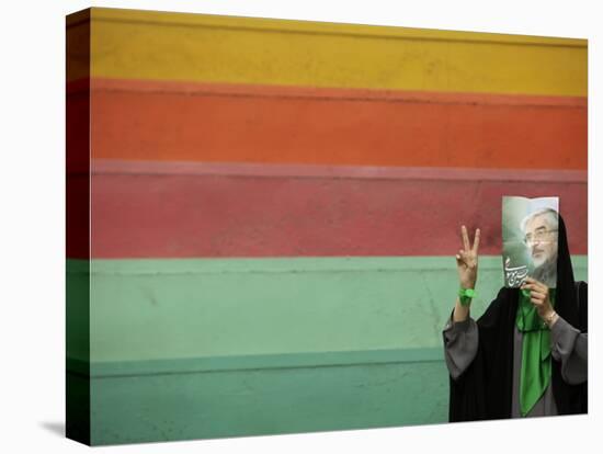 Supporter of Mir Hossein Mousavi Hides Her Face as She Waits at an Election Rally in Tehran-null-Stretched Canvas