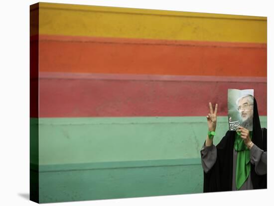 Supporter of Mir Hossein Mousavi Hides Her Face as She Waits at an Election Rally in Tehran-null-Stretched Canvas