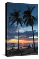 Surfer and Palm Trees at Sunset on Playa Guiones Surf Beach at Sunset-Rob Francis-Stretched Canvas