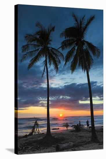 Surfer and Palm Trees at Sunset on Playa Guiones Surf Beach at Sunset-Rob Francis-Stretched Canvas