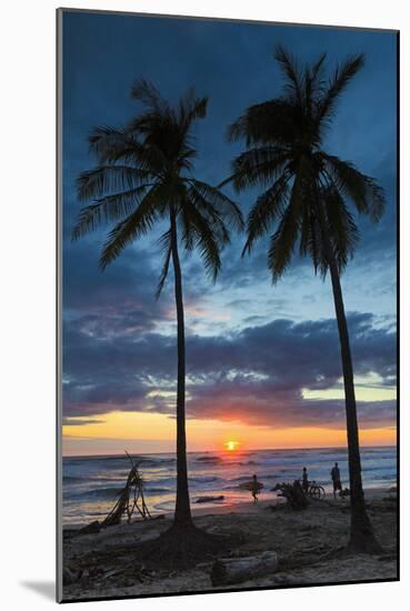 Surfer and Palm Trees at Sunset on Playa Guiones Surf Beach at Sunset-Rob Francis-Mounted Photographic Print