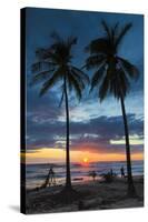 Surfer and Palm Trees at Sunset on Playa Guiones Surf Beach at Sunset-Rob Francis-Stretched Canvas