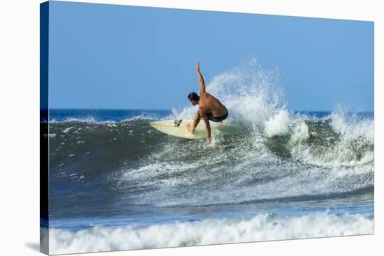 Surfer on Shortboard Riding Wave at Popular Playa Guiones Surf Beach-Rob Francis-Stretched Canvas