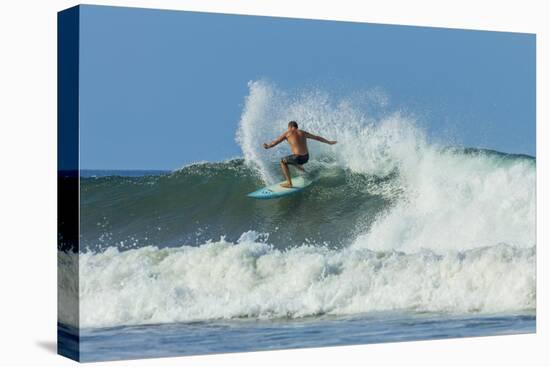 Surfer on Shortboard Riding Wave at Popular Playa Guiones Surf Beach-Rob Francis-Stretched Canvas