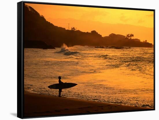 Surfer Standing at Waimea Bay at Sunset, Waimea, U.S.A.-Ann Cecil-Framed Stretched Canvas