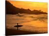 Surfer Standing at Waimea Bay at Sunset, Waimea, U.S.A.-Ann Cecil-Stretched Canvas