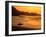 Surfer Standing at Waimea Bay at Sunset, Waimea, U.S.A.-Ann Cecil-Framed Premium Photographic Print