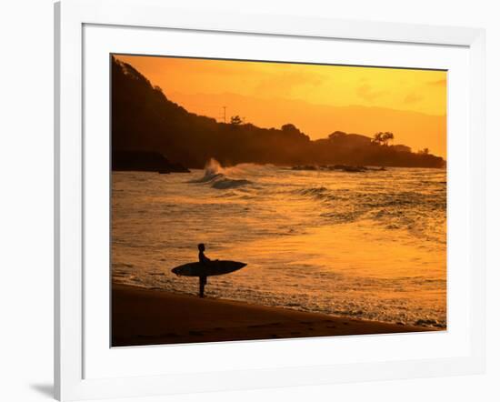 Surfer Standing at Waimea Bay at Sunset, Waimea, U.S.A.-Ann Cecil-Framed Photographic Print