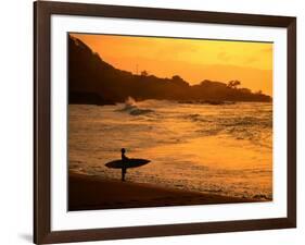 Surfer Standing at Waimea Bay at Sunset, Waimea, U.S.A.-Ann Cecil-Framed Photographic Print