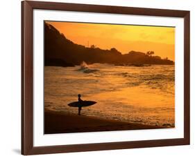 Surfer Standing at Waimea Bay at Sunset, Waimea, U.S.A.-Ann Cecil-Framed Photographic Print