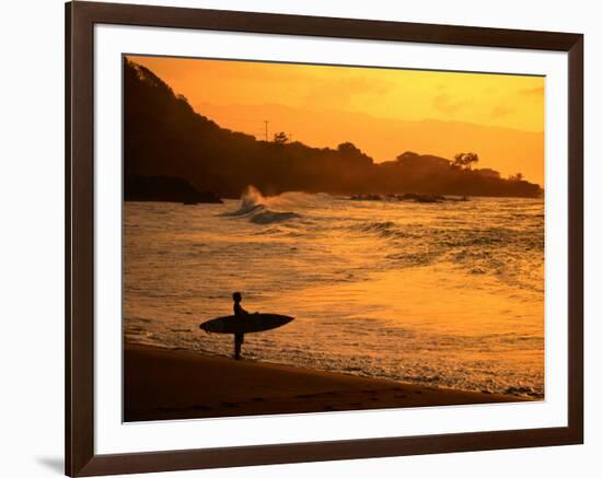 Surfer Standing at Waimea Bay at Sunset, Waimea, U.S.A.-Ann Cecil-Framed Photographic Print