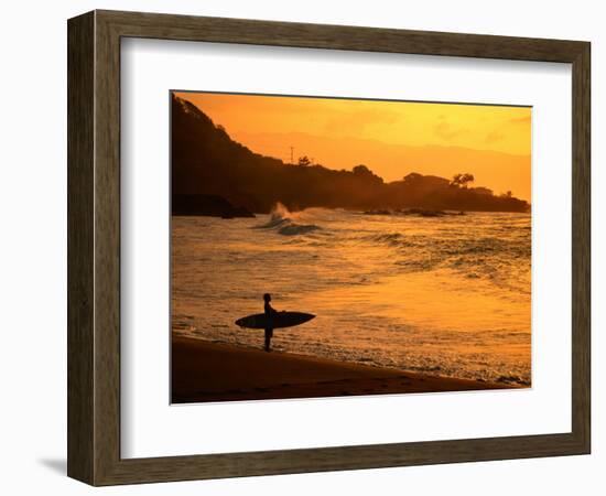 Surfer Standing at Waimea Bay at Sunset, Waimea, U.S.A.-Ann Cecil-Framed Photographic Print