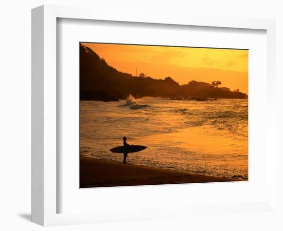 Surfer Standing at Waimea Bay at Sunset, Waimea, U.S.A.-Ann Cecil-Framed Photographic Print