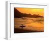 Surfer Standing at Waimea Bay at Sunset, Waimea, U.S.A.-Ann Cecil-Framed Photographic Print