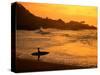 Surfer Standing at Waimea Bay at Sunset, Waimea, U.S.A.-Ann Cecil-Stretched Canvas