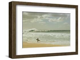 Surfer standing on the beach, North Shore, Oahu, Hawaii, USA-null-Framed Photographic Print