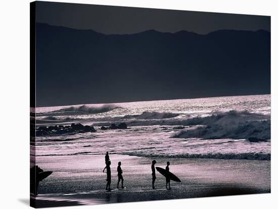 Surfers at Sunset, Ehukai, Oahu, Hawaii-Bill Romerhaus-Stretched Canvas