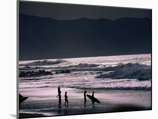 Surfers at Sunset, Ehukai, Oahu, Hawaii-Bill Romerhaus-Mounted Photographic Print