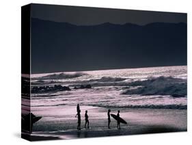 Surfers at Sunset, Ehukai, Oahu, Hawaii-Bill Romerhaus-Stretched Canvas