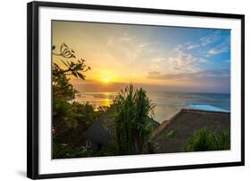 Surfers at sunset in Bali with straw roofed huts, Indonesia, Southeast Asia, Asia-Tyler Lillico-Framed Photographic Print