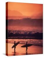 Surfers at Sunset, Oahu, Hawaii-Bill Romerhaus-Stretched Canvas