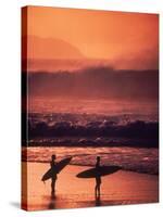 Surfers at Sunset, Oahu, Hawaii-Bill Romerhaus-Stretched Canvas