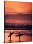 Surfers at Sunset, Oahu, Hawaii-Bill Romerhaus-Stretched Canvas