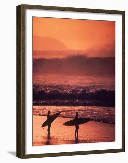 Surfers at Sunset, Oahu, Hawaii-Bill Romerhaus-Framed Premium Photographic Print