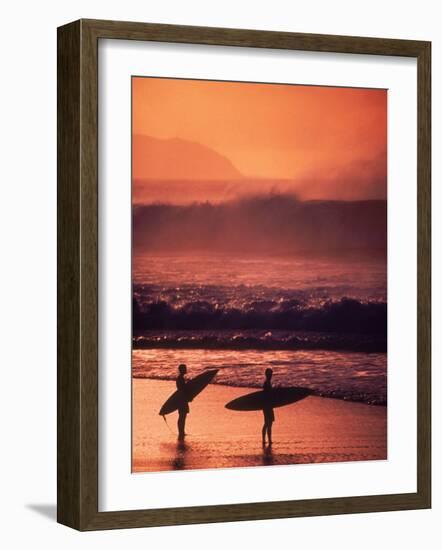 Surfers at Sunset, Oahu, Hawaii-Bill Romerhaus-Framed Photographic Print