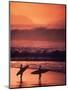 Surfers at Sunset, Oahu, Hawaii-Bill Romerhaus-Mounted Photographic Print