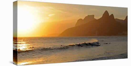 Surfers at Sunset on Ipanema Beach, Rio De Janeiro, Brazil-null-Stretched Canvas
