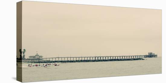 Surfers In Front Of Pier In Newport Beach-Lindsay Daniels-Stretched Canvas