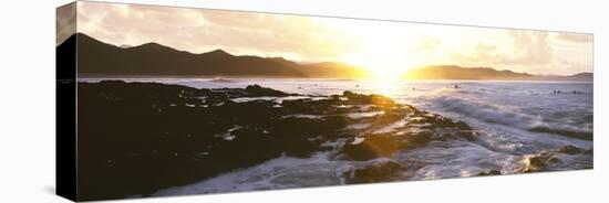 Surfers in the ocean at sunrise, Playa Los Cerritos, Cerritos, Baja California Sur, Mexico-Panoramic Images-Stretched Canvas